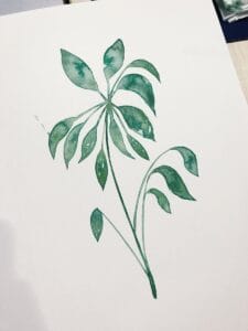 a painting of a green plant on a white paper